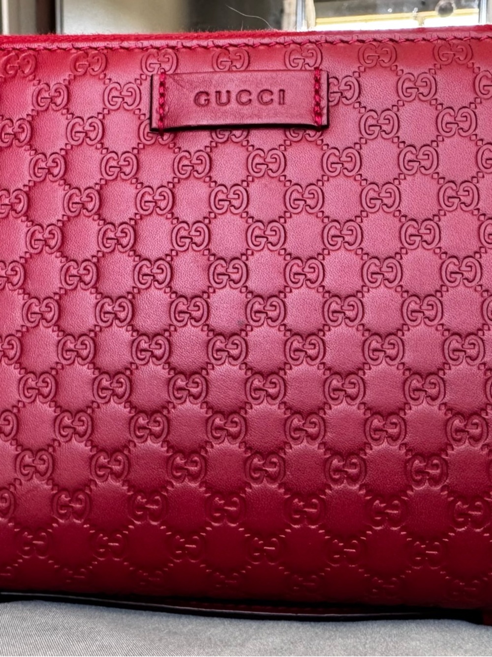 Gucci Embossed GG Leather Travel Wallet with handle in Cherry Red